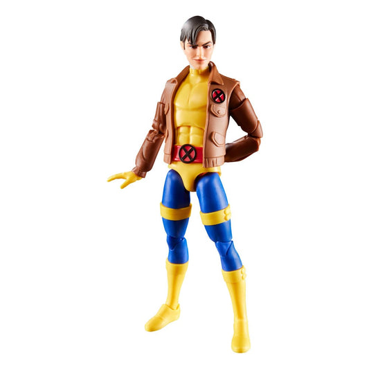 Kunststof actiefiguur van Morph met zwart haar, een bruin jack, geel-blauw pak, rode riem en gele laarzen. Staat met de benen uit elkaar, één arm achter de rug en de andere schuin omlaag, tegen een witte achtergrond.